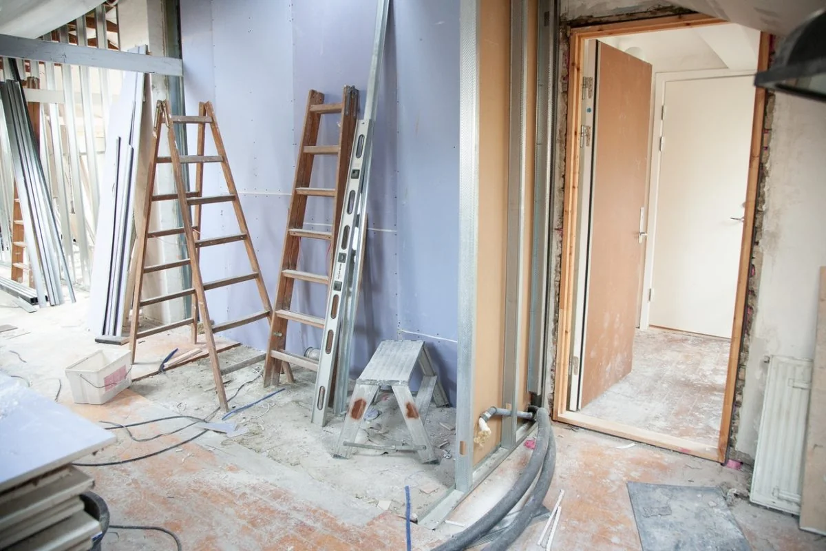 Interior renovation with metal wall studs, plasterboard partitions and ladders